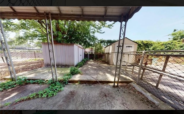 view of yard with a patio and a shed