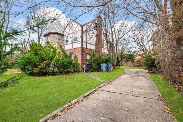 view of home's exterior with a lawn