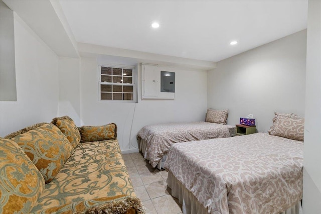 bedroom featuring light tile patterned floors and electric panel