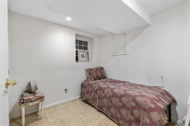 bedroom with light tile patterned floors