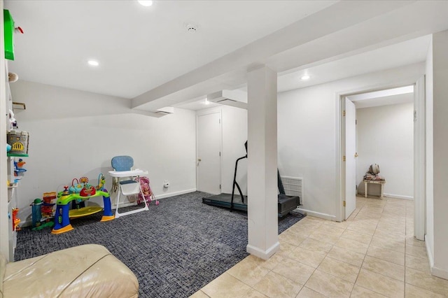 recreation room with light tile patterned flooring