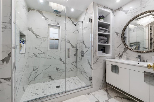 bathroom featuring vanity and a shower with shower door