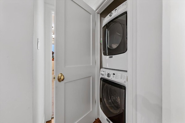 laundry area featuring stacked washer and dryer