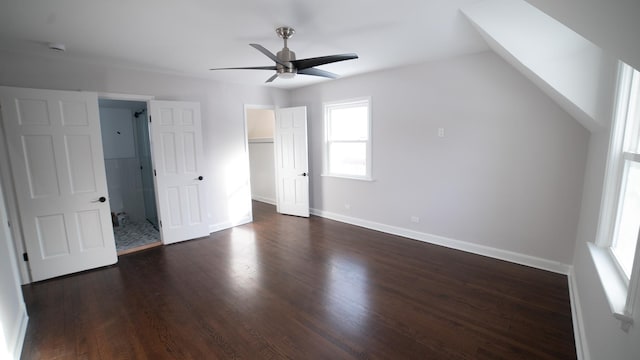 bonus room with ceiling fan and dark hardwood / wood-style flooring