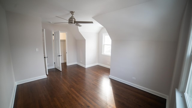 bonus room featuring ceiling fan, dark hardwood / wood-style floors, and vaulted ceiling