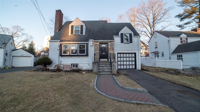 cape cod house with a front yard