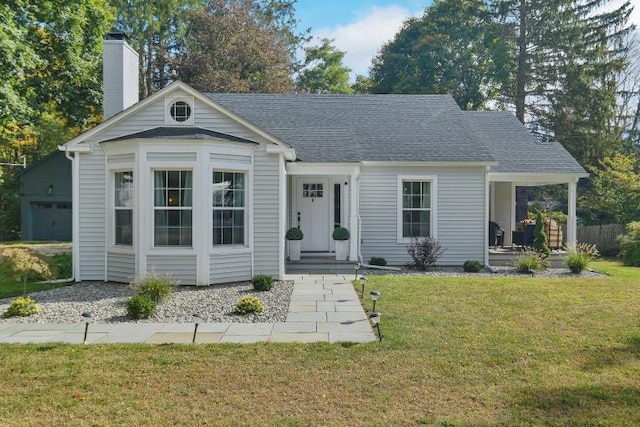 view of front of property with a garage and a front yard