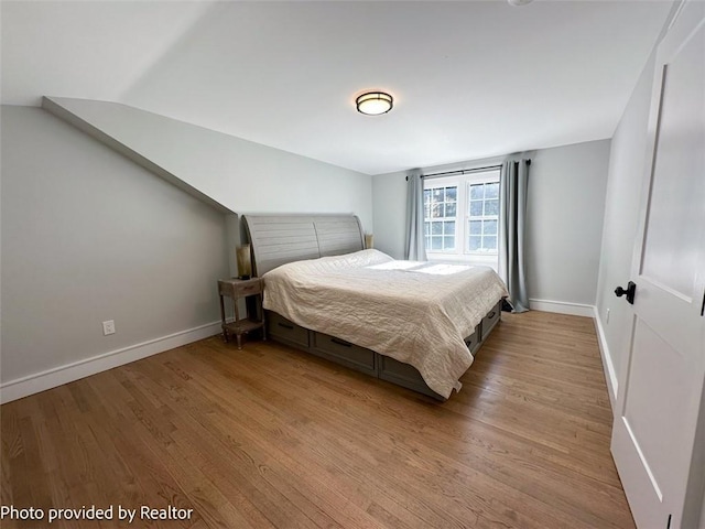 bedroom with light hardwood / wood-style floors