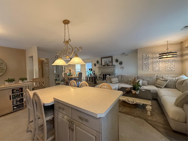 kitchen featuring pendant lighting, a kitchen breakfast bar, and a center island