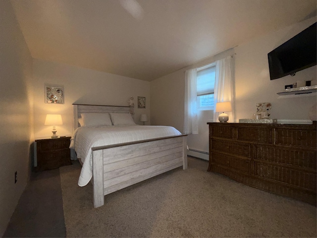 bedroom featuring dark carpet and baseboard heating