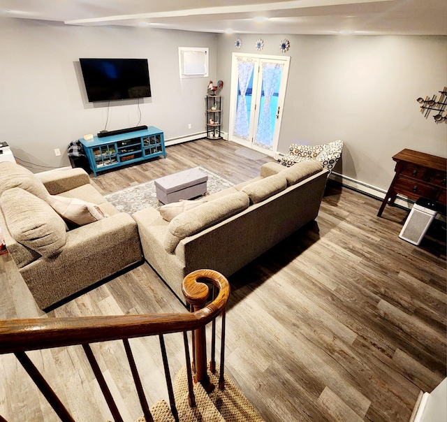 living room featuring hardwood / wood-style flooring and baseboard heating