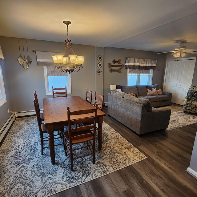 dining room with a baseboard radiator, ceiling fan with notable chandelier, and dark hardwood / wood-style flooring