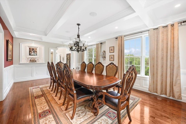 dining room with beamed ceiling, coffered ceiling, and crown molding