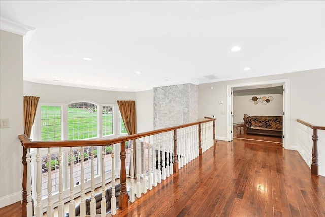 corridor with crown molding and dark hardwood / wood-style flooring