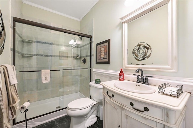 bathroom with tile patterned floors, toilet, a shower with shower door, ornamental molding, and vanity