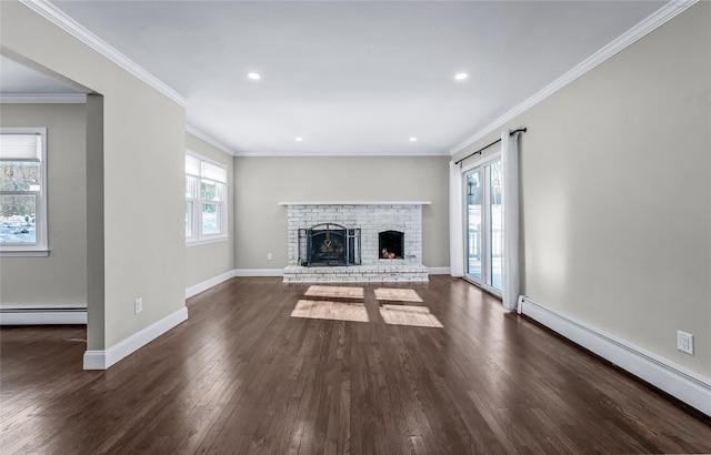 unfurnished living room featuring ornamental molding, a fireplace, and baseboard heating