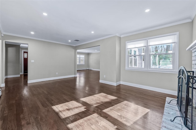 unfurnished living room featuring dark wood-type flooring and crown molding