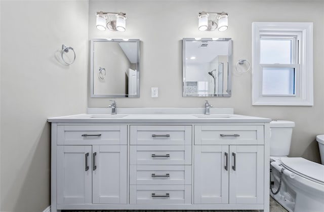 bathroom with vanity and toilet