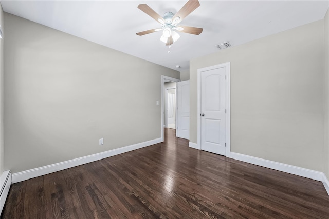 unfurnished bedroom with dark hardwood / wood-style floors, ceiling fan, and baseboard heating