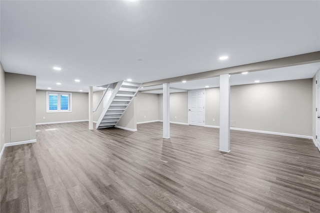 basement with hardwood / wood-style flooring