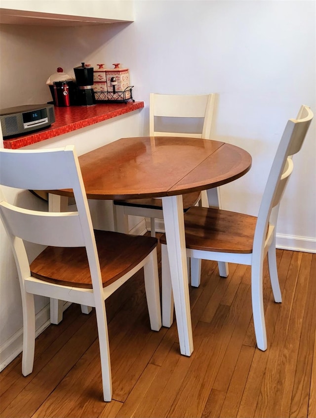 dining room with hardwood / wood-style flooring