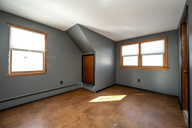 bonus room featuring baseboard heating