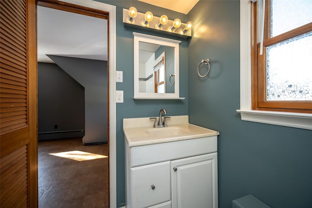 bathroom with vanity and a baseboard heating unit