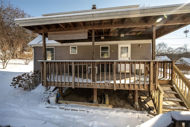 view of snow covered deck