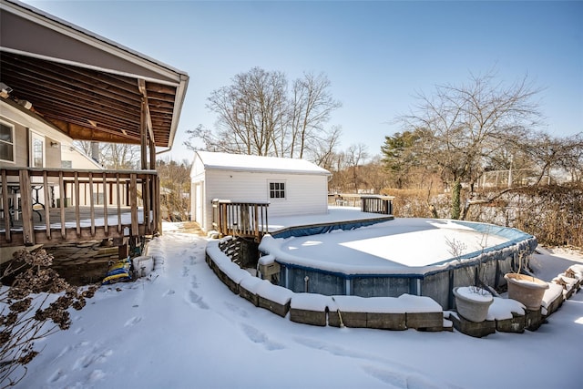 exterior space featuring an outdoor structure and a pool side deck