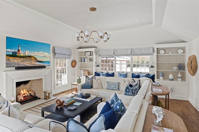 living room featuring wood-type flooring and ornamental molding