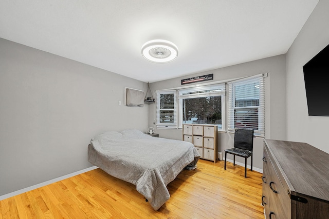 bedroom with light wood-type flooring