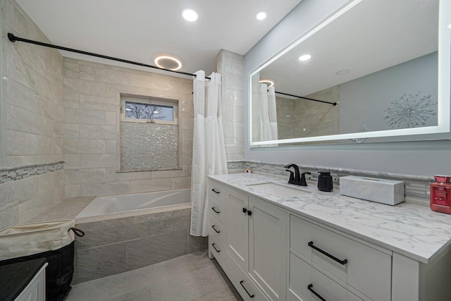 bathroom with vanity, tile patterned flooring, and shower / bath combo with shower curtain