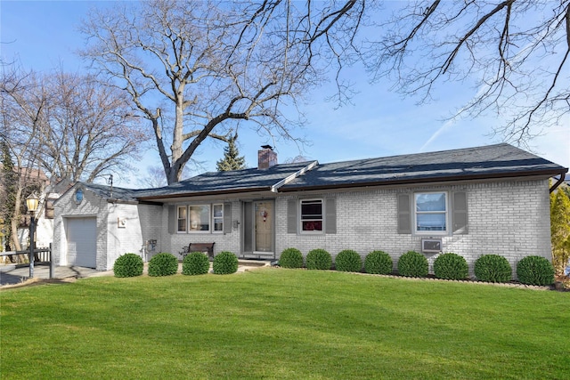 ranch-style house with a garage and a front yard