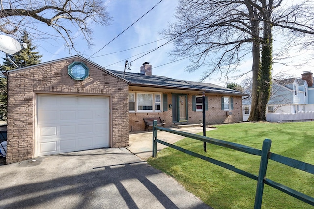 ranch-style home with a garage and a front lawn