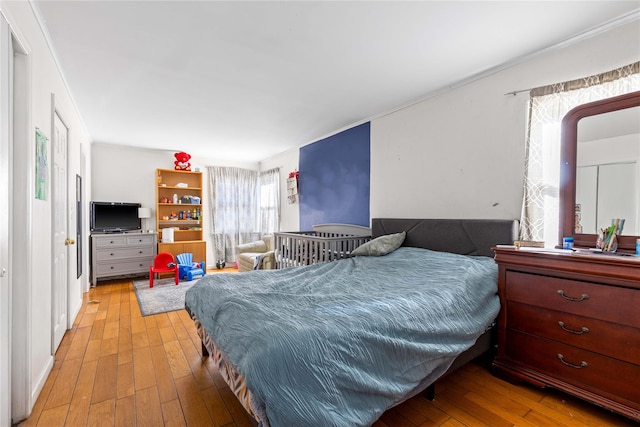 bedroom with light wood-type flooring