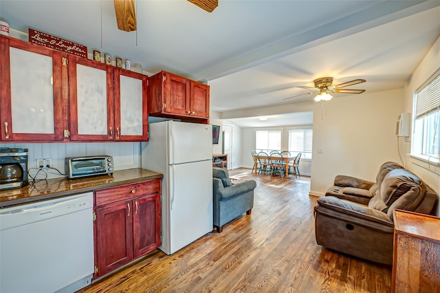 kitchen featuring ceiling fan, white appliances, and light wood-type flooring