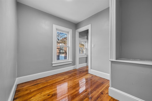 spare room with hardwood / wood-style floors