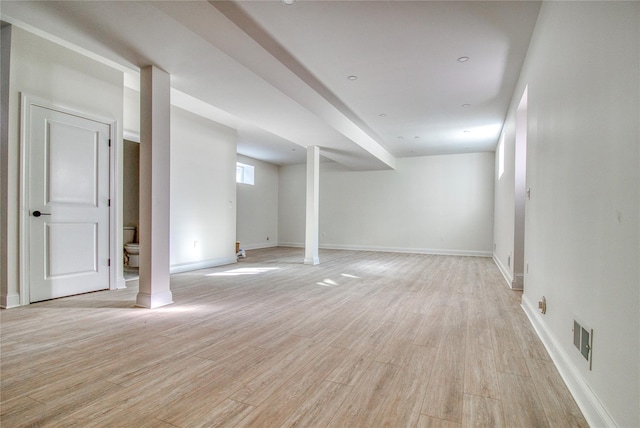 basement featuring light wood-type flooring