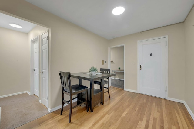 dining space with light hardwood / wood-style floors