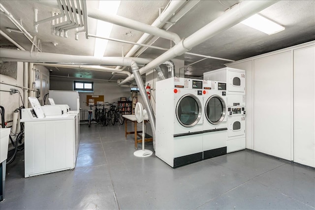 washroom featuring stacked washer / dryer and washer and dryer