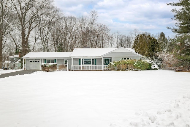 single story home with a garage and a porch