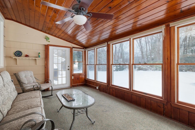 sunroom / solarium featuring lofted ceiling, wood ceiling, and ceiling fan