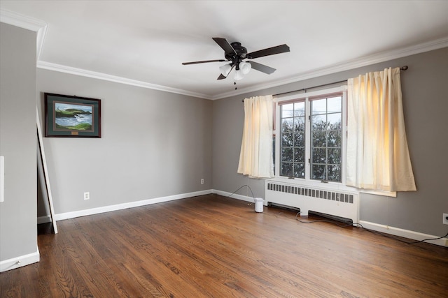 spare room with crown molding, radiator heating unit, dark hardwood / wood-style floors, and ceiling fan