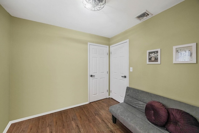 sitting room with dark hardwood / wood-style floors