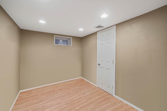 basement featuring light wood-type flooring