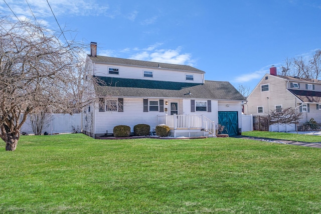 back of property featuring a lawn