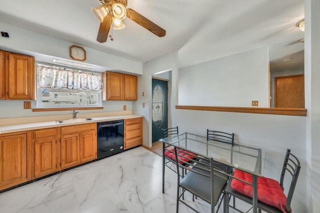 kitchen featuring ceiling fan, black dishwasher, and sink