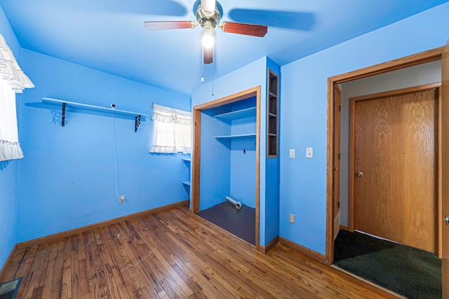 unfurnished bedroom with hardwood / wood-style flooring and ceiling fan