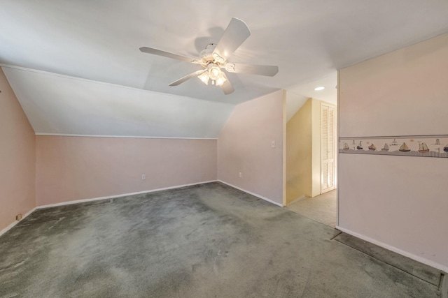 additional living space featuring vaulted ceiling, carpet flooring, and ceiling fan