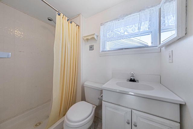 bathroom with vanity, a shower with curtain, and toilet